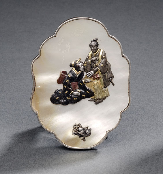 <b>A BELT BUCKLE WITH INLAID COLOURED METAL DECOARTION OF A NOBLE COUPLE ON MOTHER-OF-PEARL MOUNTED WITH SIVER</b>