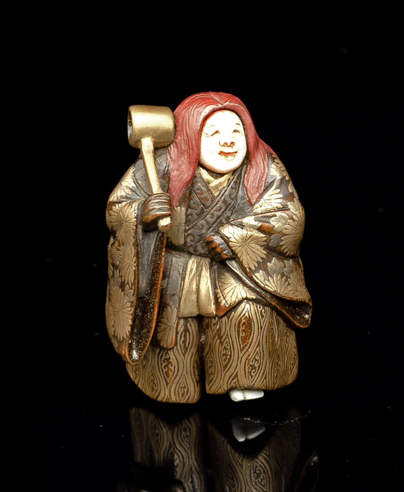 <b>A LACQUERED WOOD NETSUKE OF SHOJO WITH DETAILS CARVED IN IVORY</b>
