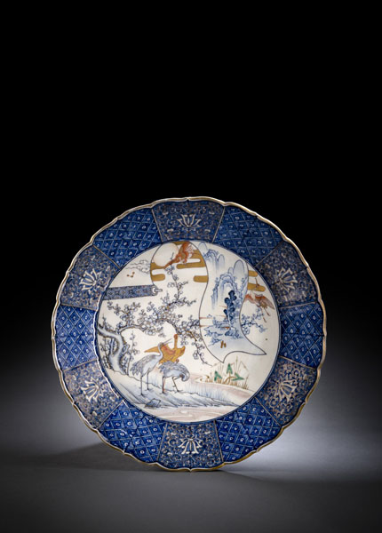 <b>A LARGE LOBED PORCELAIN CHARGER DECORATED WITH CRANES</b>