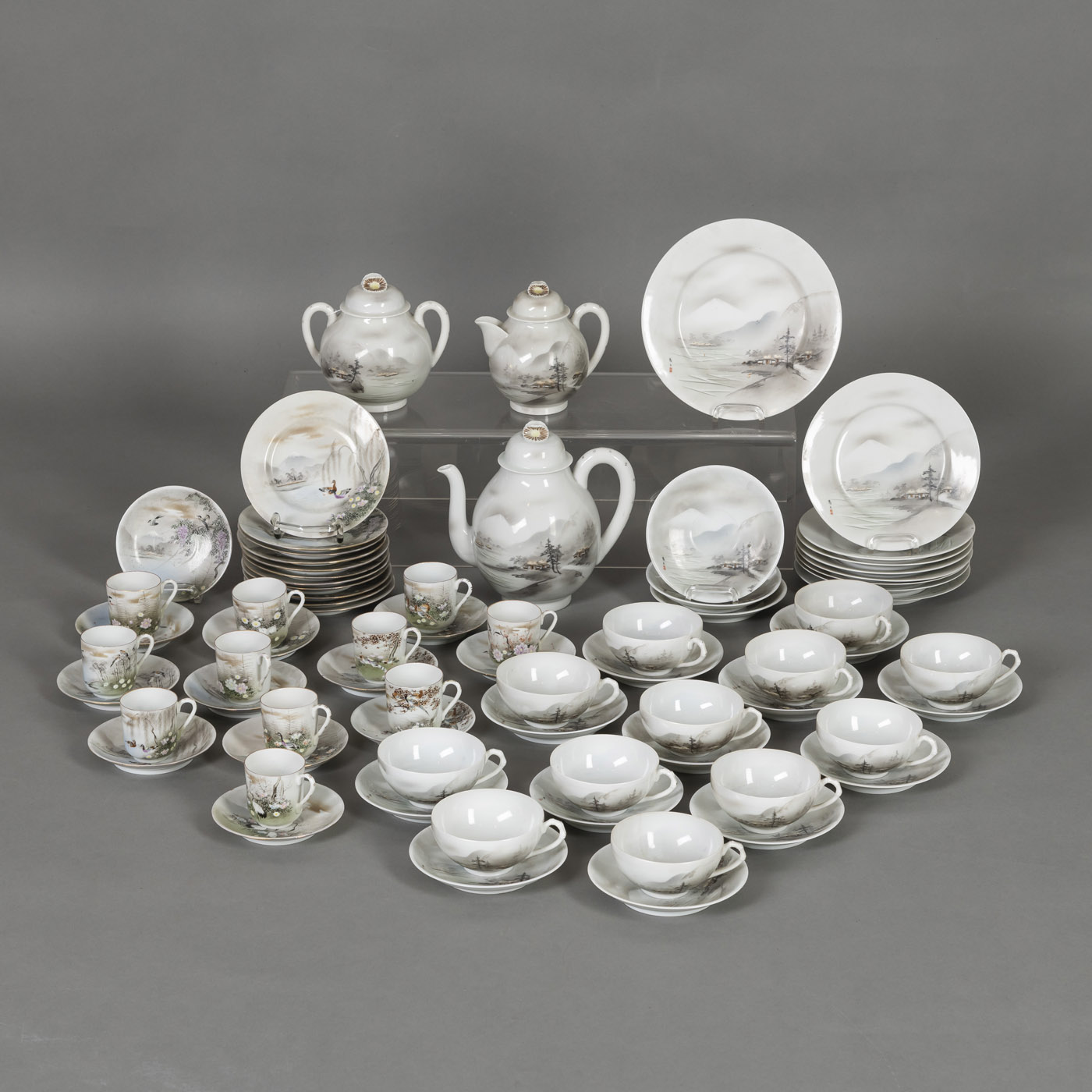 <b>A FUJIYAMA-DECORATED PORCELAIN MOCHA AND A TEA SERVICE</b>