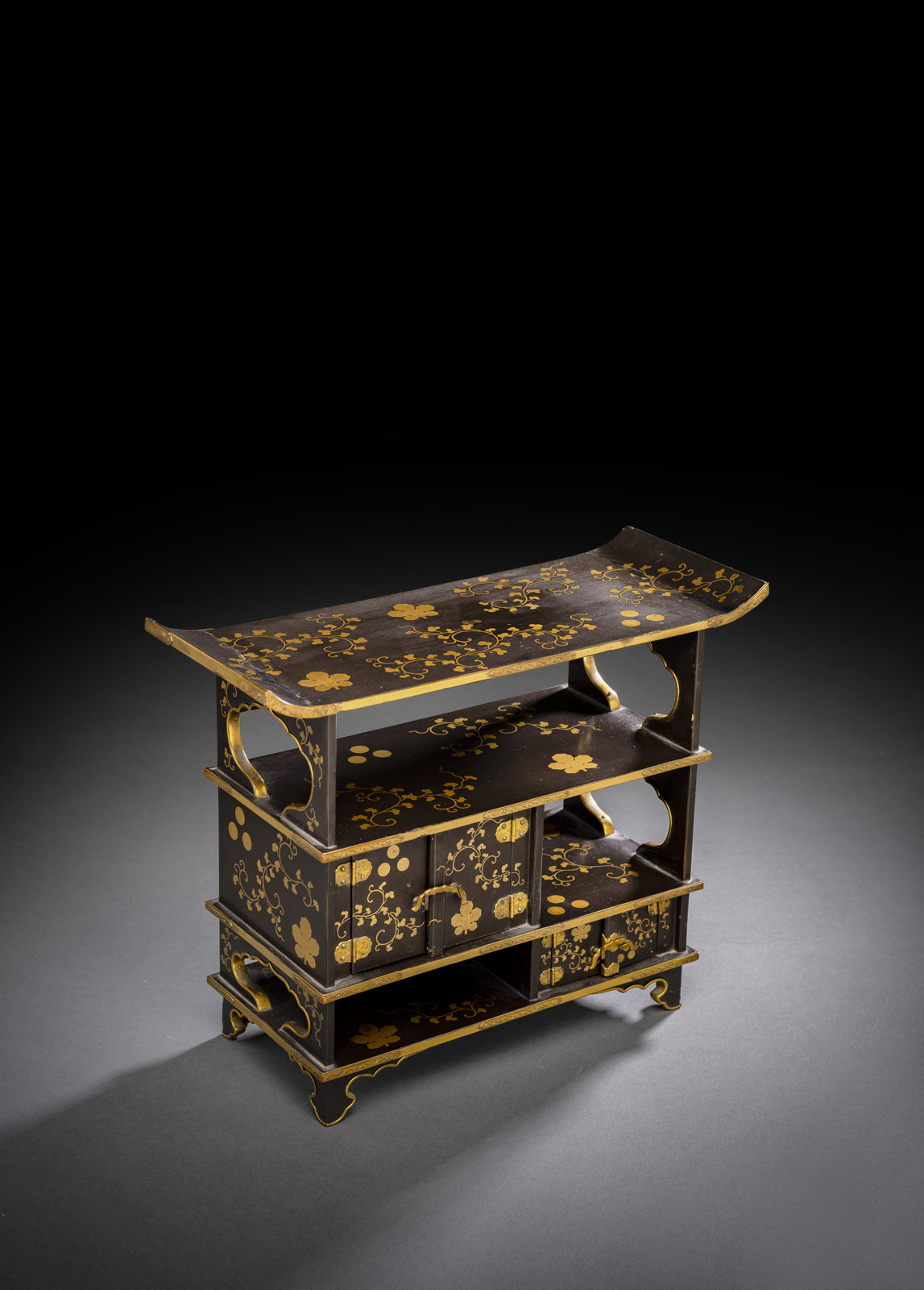 <b>A SMALL GOLD-INLAID LACQUER CABINET</b>