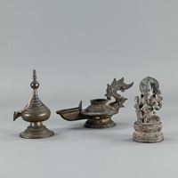 <b>A BRONZE FIGURE OF GANESHA, AN OIL LAMP, AND A STUPA</b>