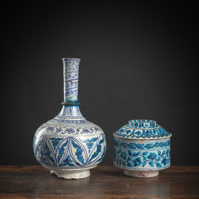 <b>A GLAZED LIDDED POTTERY VESSEL WITH FLORAL DECORATION AND A BLUE AND PETROL GLAZED POTTERY VASE WITH FLORAL ORNAMENTATION</b>
