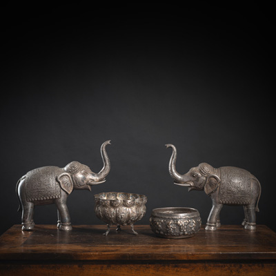 <b>TWO METAL-FITTED ELEPHANTS SCULPTURES, A FOOTED REPOUSSÉ SILVER BOWL IN THE SHAPE OF A FLOWER WITH FIGURAL DECORATION AND ANOTHER SILVER BOWL</b>
