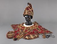 <b>FIVE CEREMONIAL BONE GARMENTS: A HAT, A BREAST ORNAMENT WITH RED-GROUND FABRIC PONCHO, A PAIR OF ARM ORNAMENTS, A SINGLE FACE OF A WRATHFUL FIGURE</b>