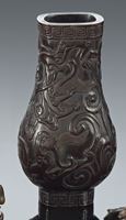 <b>A HU-SHAPED CARVED DARK BROWN WOOD VASE WITH CHILONG</b>