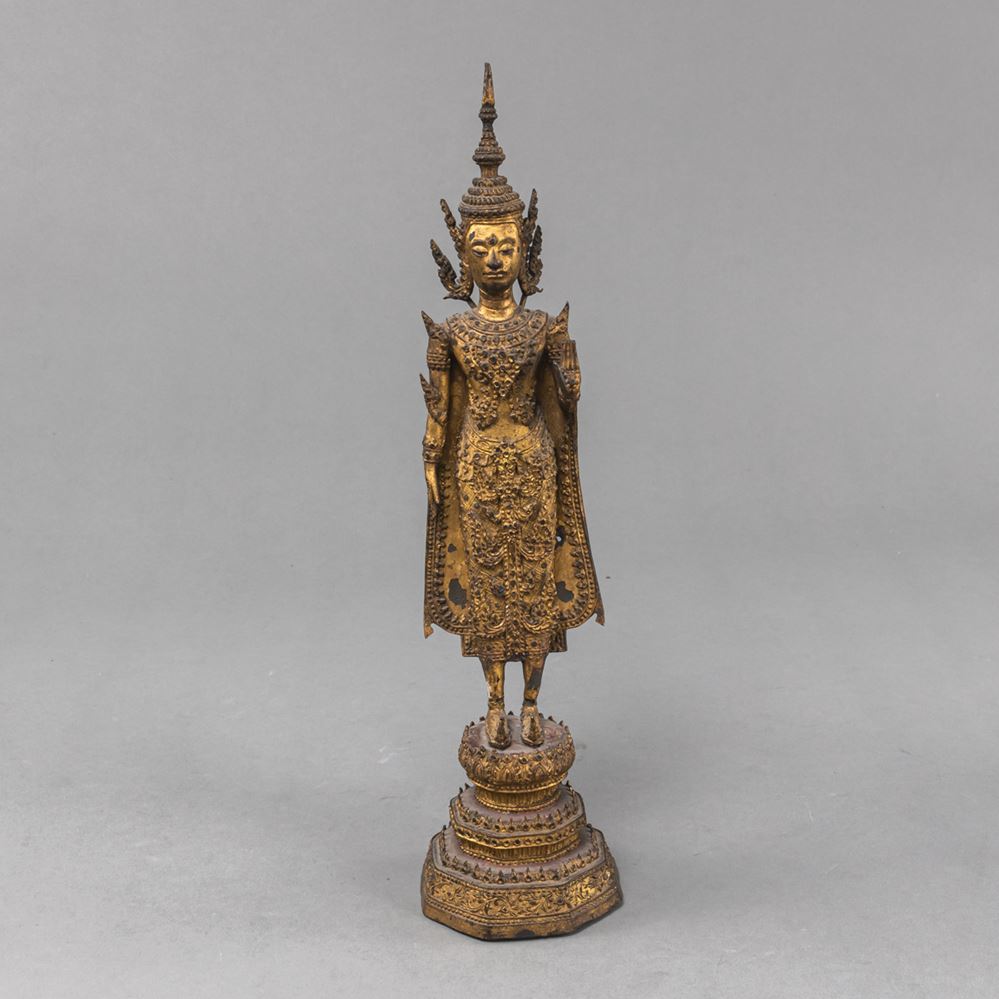 <b>A GILT-BRONZE FIGURE OF STANDING BUDDHA</b>