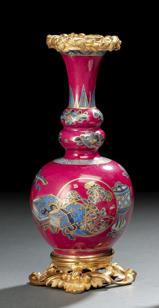 <b>A GOURD-SHAPED BLUE AND WHITE VASE WITH PURPLE GROUND IN GILT-ORMOLU MOUNTS</b>