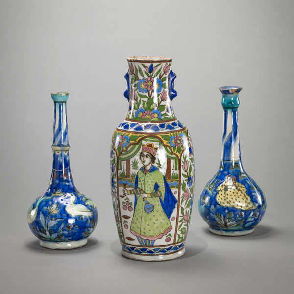 <b>TWO POLYCHROME PAINTED AND MOULDED POTTERY FASKS AND A POLYCHROME PAINTED VASE</b>