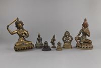 <b>A GROUP OF SEVEN BRONZE FIGURES OF MANJUSHRI, BUDDHA, AMITAYUS, SHADAKSHARI, TARA AND OTHERS</b>