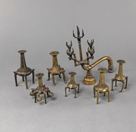 <b>SEVEN BRONZE CANDLESTICKS</b>
