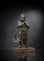 <b>A BRONZE FIGURE OF WEITUO MOUNTED ON A STONE PLINTH</b>