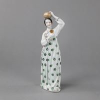 <b>A POLYCHROME PORCELAIN FIGURE OF A YOUNG WOMAN</b>