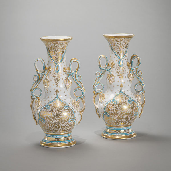 <b>A PAIR OF GOLD-DECORATED VINE HANDLED PORCELAIN VASES</b>