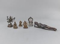 <b>SIX BRONZE FIGURES OF BUDDHA PARANIRVANA, GUANYIN, SYAMATARA, GANESHA ET AL.</b>