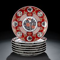 <b>A SET OF SEVEN IRON-RED GROUND ARITA DISHES</b>