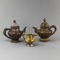 <b>THREE PARCEL-GILT COPPER EWERS</b>