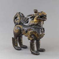 <b>LARGE MYTHOLOGICAL ANIMAL (QILIN OR LION) AS GUARDIAN FIGURE, REPOUSSÉ BRONZE, PATINATED AND GILT</b>