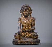 <b>A LACQUER GILT STUCCO FIGURE OF SEATED BUDDHA IN MARAVIJAYA POSITION</b>