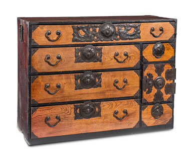 <b>A KEYAKI WOOD- AND METALL FITTED TANSU CONTAINING EIGHT DRAWERS</b>