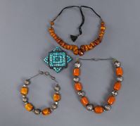 <b>A TURQUOISE-INLAID AMULET BOX AND THREE AMBER BRACELETS</b>