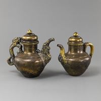 <b>TWO MIXED-METAL LIDDED EWERS</b>