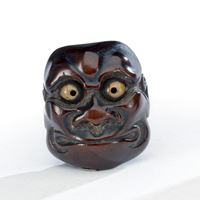 <b>A GROUP OF THREE CARVED WOOD NETSUKE</b>