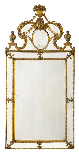 The rectangular plate within a mirrored outer frame, surmounted by a mirrored cresting with central mask, issuing floral garlands and flower baskets. Minor restorations and damages/traces due to age.