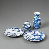 <b>TWO BLUE AND WHITE PORCELAIN CHARGERS, A VASE, AND A GINGER JAR WITH COVER</b>