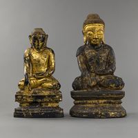 <b>TWO SEATED WOODEN FIGURES OF BUDDHA ON A BASE, PARTLY GILDED WITH LACQUER</b>