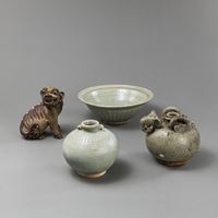 <b>THREE CELADON CERAMIC PIECES AND A POLYCHROME BISCUIT PORCELAIN FO LION</b>