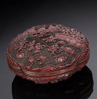 <b>A WELL CARVED CINNABAR LACQUER BOX AND COVER DECORATED ON BOTH SIDES WITH IMMORTALS IN PARADISE</b>