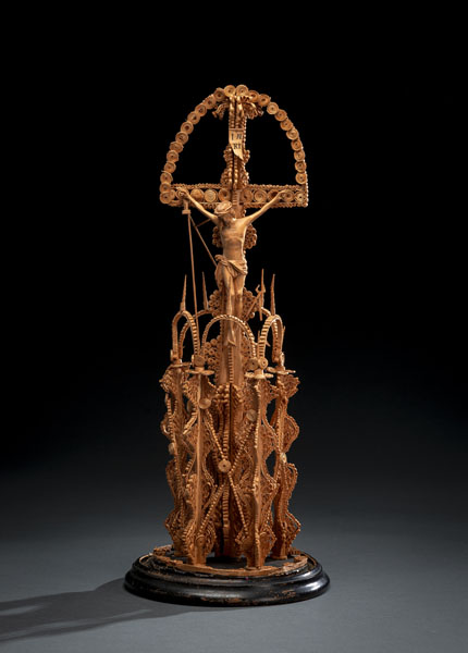 <b>Carved wood and filigree work of rolled and twisted wood ribbons and chips in the manner of Gothic pinnacles. With a glass cover. Damages due to age, minor losses.</b>