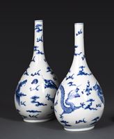 <b>A PAIR OF BLUE AND WHITE DRAGON BOTTLE VASES</b>