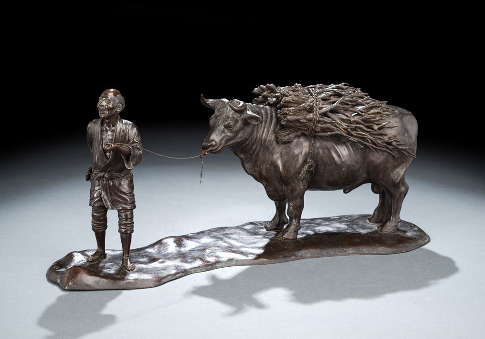 <b>A CAST-BRONZE GROUP OF A PEASANT MAN WITH HIS OX</b>