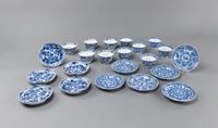 <b>A SET OF ELEVEN BLUE AND WHITE PORCELAIN CUPS AND SAUCERS</b>