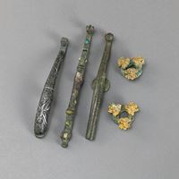 <b>TWO BRONZE ROBE BUTTONS AND THREE BELT HOOKS IN THE ARCHAIC STYLE</b>