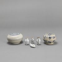 <b>TWO BLUE AND WHITE BOXES AND COVERS AND FOUR MEDICINE BOTTLES</b>