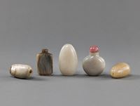 <b>FIVE JADE SNUFFBOTTLES AMONG OTHERS IN PEBBLE - SHAPE</b>
