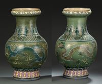 <b>A PAIR OF GREEN GROUND FAMILLE ROSE DRAGON VASES</b>