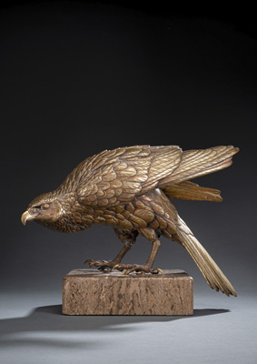 <b>A GILT-BRONZE MODEL OF AN EAGLE ON A TRAVERTINE PLINTH</b>