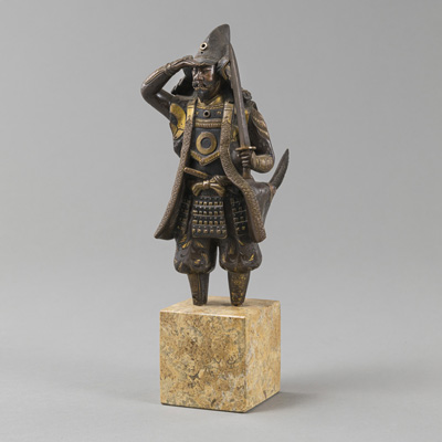 <b>A BRONZE FIGURE OF AN ARMED SAMURAI, LOOKING INTO THE DISTANCE, MOUNTED ON A STONE BASE</b>