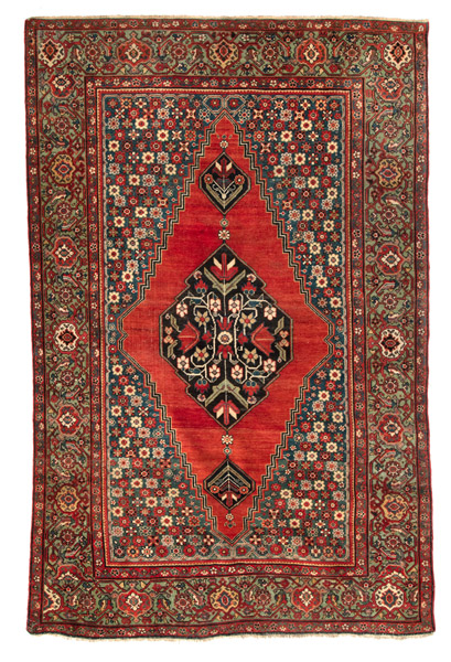 <b>A RED-BACKGROUND FARAHAN MEDALLION RUG</b>