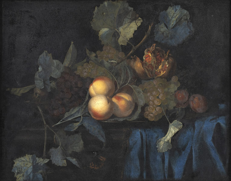Still life of peaches, grapes and a pomegranate on a blue blanket in front of a dark background. Oil/canvas/panel.