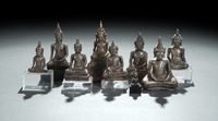 <b>EIGHT SILVER,  SILVER FOIL OR METAL FIGURES OF BUDDHA SHAKYAMUNI</b>