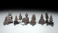 <b>ELEVEN SILVER FOIL, SILVER OR METAL FIGURINES OF BUDDHA SHAKYAMUN</b>