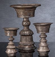 <b>A GROUP OF BUTTER LAMPS, PARTLY WORKED IN SILVER</b>