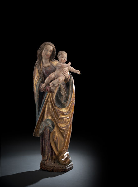 Virgin and Child. Probably Limewood, carved with deeply hollowed back. Remnants of old polychromy, overplainted. Damages due to age, loss to right side of bottom. Restorations.