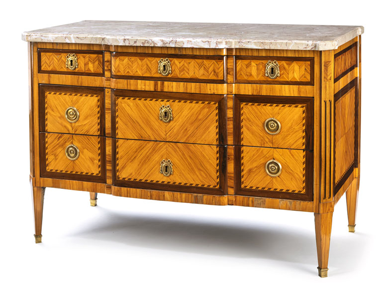 The rectangular body with beveled edges on four fluted feet. Geometric ornamental marquetry, the two large drawers worked 