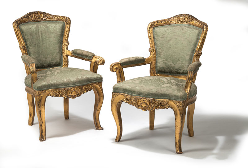 <b>A PAIR OF LUXURIANT CARVED GILTWOOD FAUTEUILS</b>